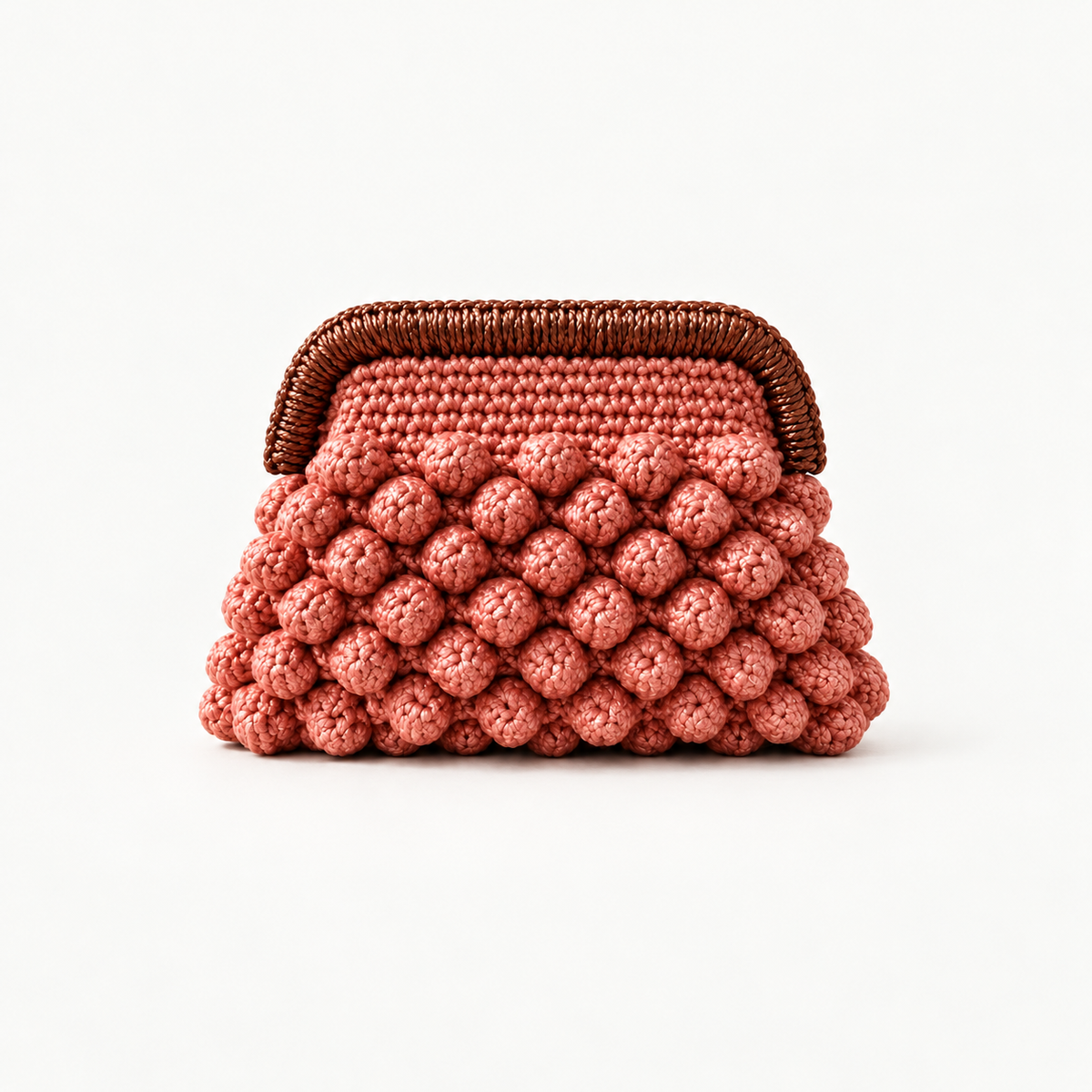 NAXOS BLUSH handmade crochet bobble clutch on off-white background