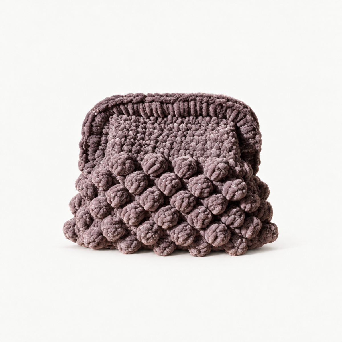 NAXOS PEBBLE handmade crochet bobble clutch on off-white background